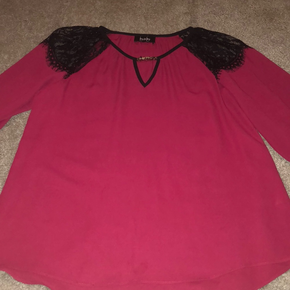 A blouse never been worn. No holes or tears